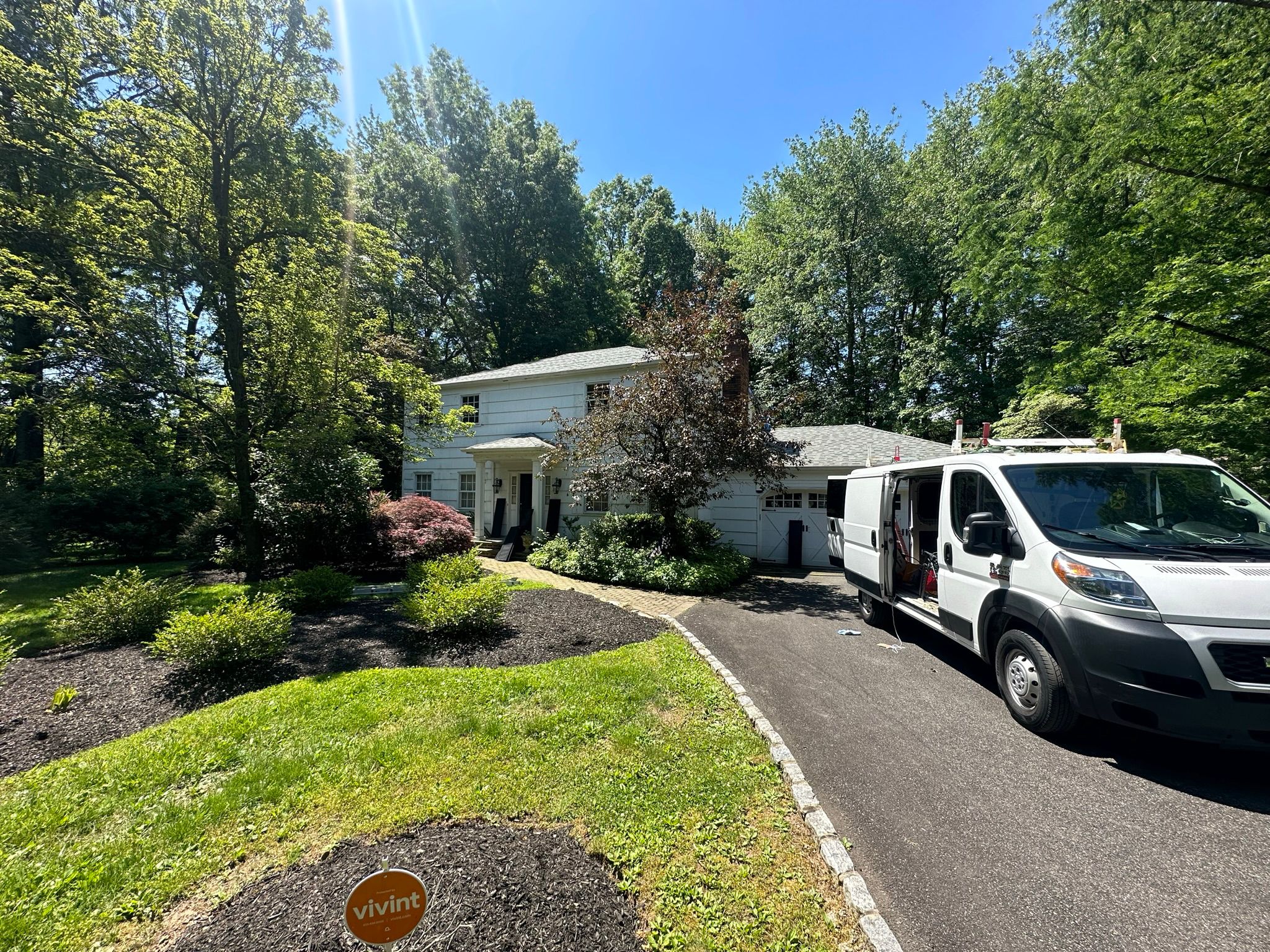 Clarke's professional van parked in front of a house.
