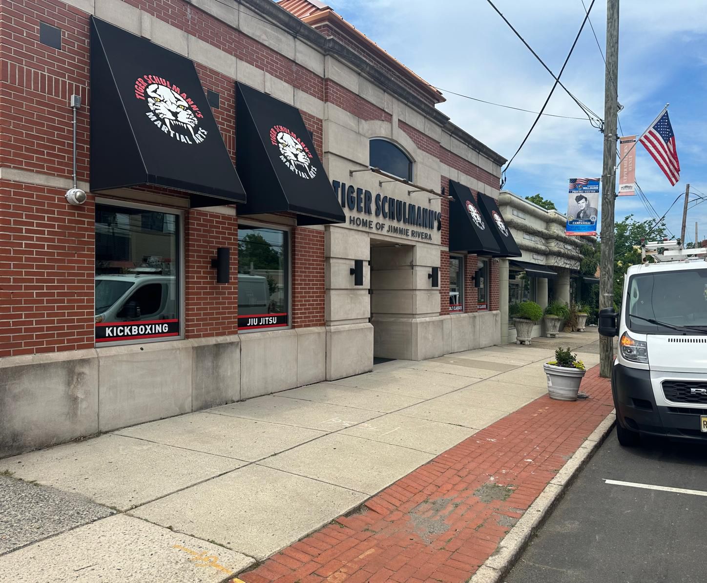 Tiger Schulmann's Martial Arts academy storefront with kickboxing and Jiu-Jitsu signage.